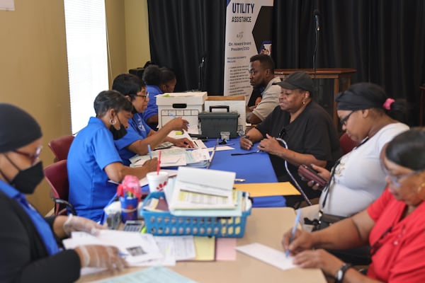 The Fulton Atlanta Community Action works with residents to pay utility bills at Northwest Power Youth Center at  Magnolia Park Apartments in Atlanta on Wednesday, July 26, 2023. FACA is providing residents with assistance through the Low Income Home Energy Assistance Program to cover higher summer utility bills. (Natrice Miller/natrice.miller@ajc.com)