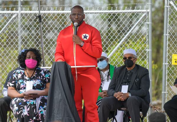 The Rev. Jamal Harris Bryant, pastor of New Birth Missionary Baptist Church, addresses the crowd gathered at the site of the former Chattahoochee Brick Company during a sacred event to commemorate the lives lost during the period the company used the convict lease system. The event included a procession, prayers, libations, community testimonials and site consecration Saturday, April 3, 2021, in Atlanta. (Photo: Daniel Varnado for The Atlanta Journal-Constitution)