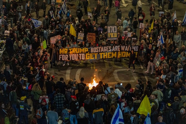 People take part in a protest in Tel Aviv, Israel, Saturday, March 8, 2025, demanding the immediate release of hostages held by Hamas in the Gaza Strip. (AP Photo/Ariel Schalit)