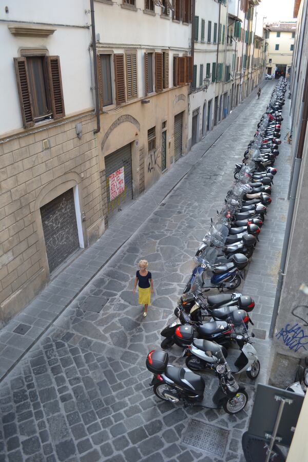 "These scooters were lined up outside my hotel window on a recent trip to Florence. As I got my camera to take the shot, this woman in a yellow dress approached and I knew that she would be the perfect subject for the image. Molto Bene!" wrote George Wainwright of Senoia.