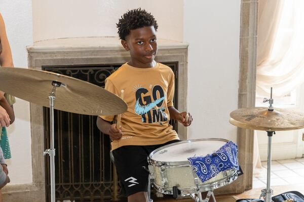 Timothy Boswell plays the drums for the first time at a Callanwolde Fine Arts Center summer camp. PHIL SKINNER FOR THE ATLANTA JOURNAL/CONSTITUTION