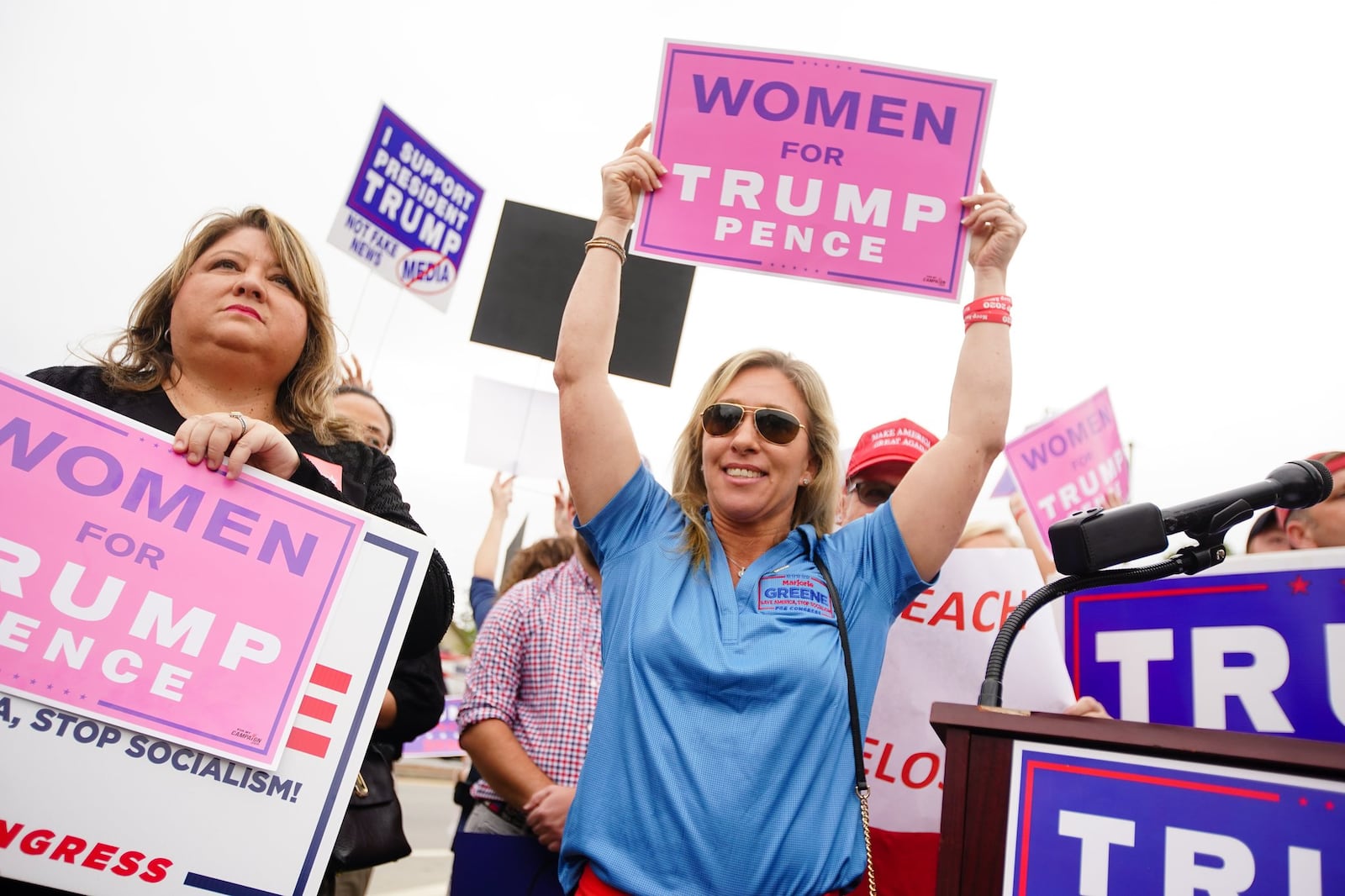 Marjorie Greene (center) of Milton, the leading candidate for Georgia’s 14th Congressional District, participates in a “Stop Impeachment Now” rally outside the office of U.S. Rep. Lucy McBath on October 9, 2019, in Sandy Springs. (Elijah Nouvelage for The Atlanta Journal-Constitution)