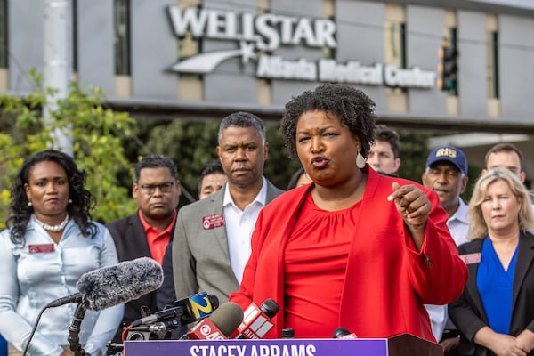 Stacey Abrams speaks at a news conference alongside health care providers outside the WellStar Atlanta Medical Center on Sept. 2, 2022. (Steve Schaefer/The Atlanta Journal-Constitution/TNS)