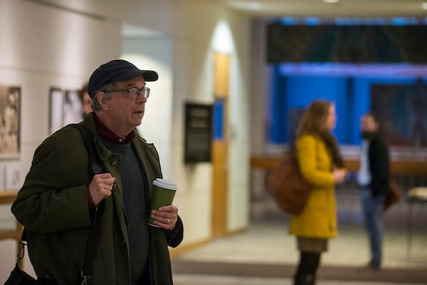 A man stops to look at the ‘Framing Shadows’ exhibit at the Robert W. Woodruff Library on the Emory campus. Barbara Krauthammer, co-author of “Envisioning Emancipation: Black Americans and the End of Slavery,” says that how viewers respond to the photos may depend on their personal history and relationship to domestic workers as much as their race.