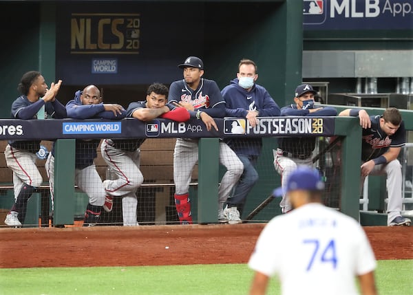 Braves watch from the dugout as pitcher Kenley Jansen closes them out in the 9th inning, falling to the Dodgers 3-1 in game 6 of the National League Championship Series on Saturday, Oct 17, 2020 in Arlington.   “Curtis Compton / Curtis.Compton@ajc.com”