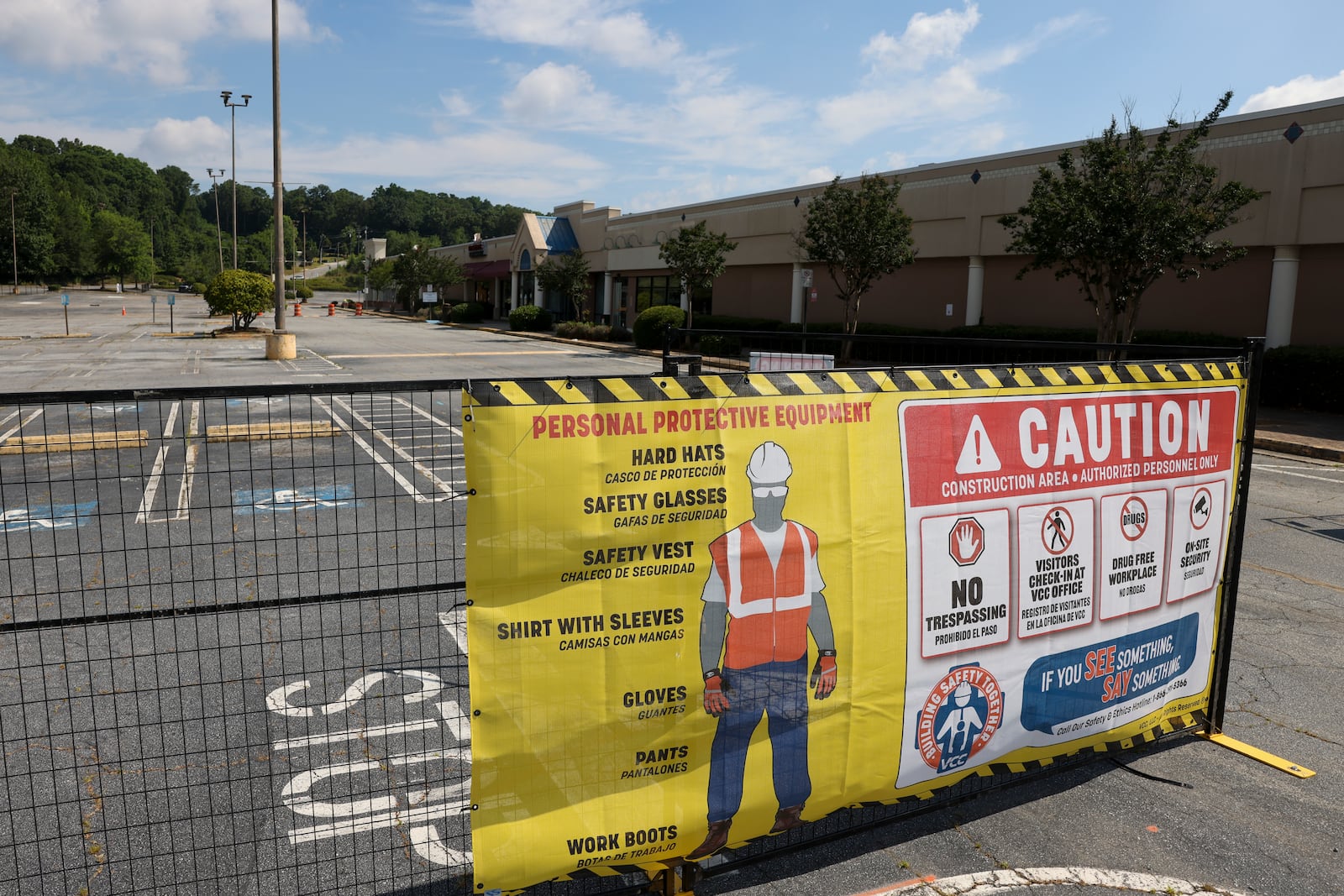 A sign for personal protection equipment is shown outside of gates to the North DeKalb Mall, Monday, June 24, 2024, in Decatur, Ga. The North DeKalb mall is scheduled to be demolished starting Wednesday morning, June 26th. (Jason Getz / AJC)
