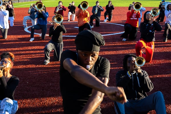 The Jonesboro High School "Majestic Marching Cardinals," as the band is known, rehearse at the high school on Wednesday, Nov. 20, 2024. The group will play in The Macy's Thanksgiving Day Parade in New York and the 2026 New Year's Day Parade in London. (Arvin Temkar/AJC)