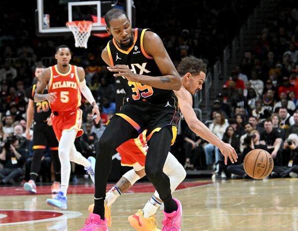 Atlanta Hawks guard Trae Young (11) steals the ball from Phoenix Suns forward Kevin Durant (35) during the second half. (Hyosub Shin / Hyosub.Shin@ajc.com)