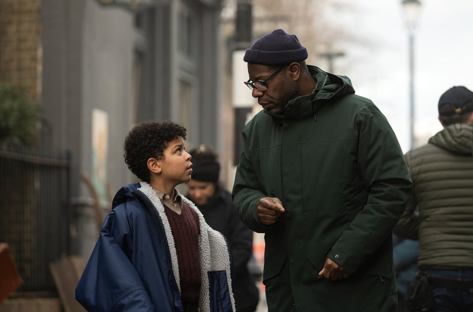 This image released by Apple TV+ shows Elliott Heffernan, left, and filmmaker Steve McQueen on the set of "Blitz." (Apple TV+ via AP)