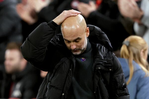 Manchester City's head coach Pep Guardiola reacts after Liverpool scored their second goal during the English Premier League soccer match between Liverpool and Manchester City at Anfield Stadium, Liverpool, England, Sunday Dec. 1, 2024. (AP Photo/Ian Hodgson)