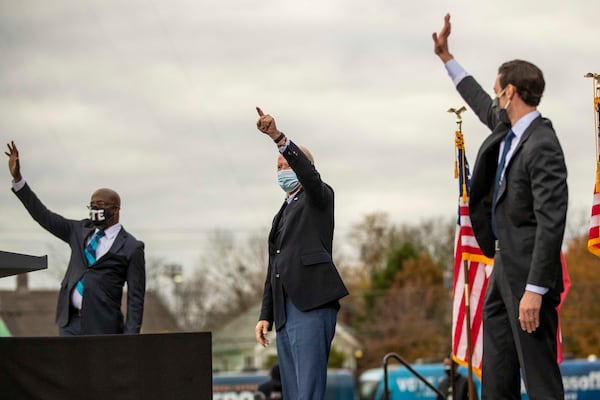 12/15/2020 —  Atlanta, Georgia — President-Elect Joseph Biden (center) greets the crowd with Georgia U.S. Democrat Senate candidates Rev. Raphael Warnock (left) and Jon Ossoff (right) following a “Get Ready to Vote” rally at Pratt-Pullman Yard in Atlanta’s Kirkwood neighborhood, Tuesday, December 15, 2020.  (Alyssa Pointer / Alyssa.Pointer@ajc.com)