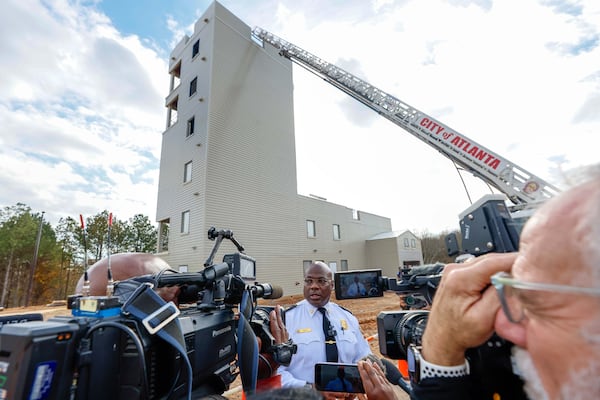 Atlanta Fire Chief Roderick Smith speaks in front of the Public Safety Training Center's fire tower, which will help firefighters practice flame-battling techniques.