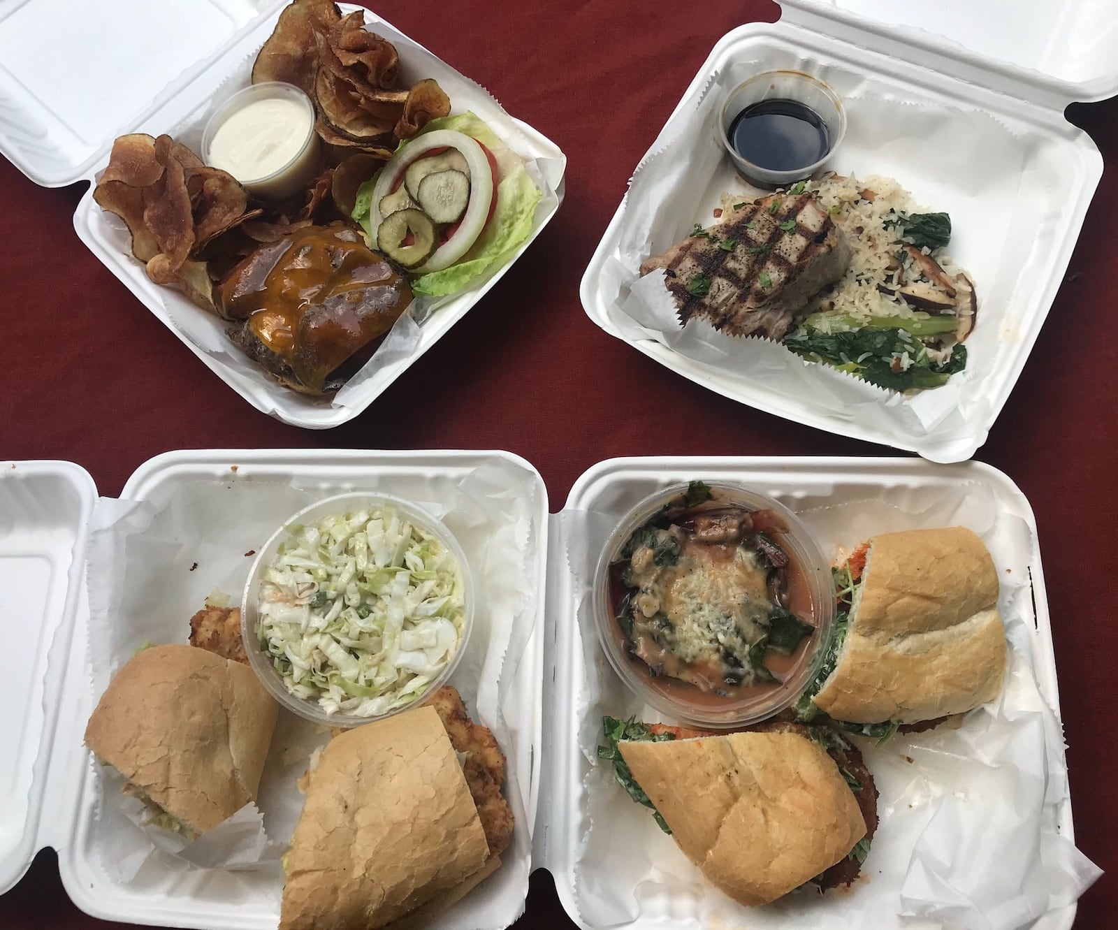 Pea Ridge offers homestyle American fare. Pictured, clockwise from top left: Pea Ridge-style burger with house-made fries and a creamy horseradish dip; market catch, featuring grilled tuna; Buffalo shrimp sandwich with a side of wilted Swiss chard and melted Asiago; and the flash-fried North Carolina trout sandwich with coleslaw. LIGAYA FIGUERAS / LIGAYA.FIGUERAS@AJC.COM