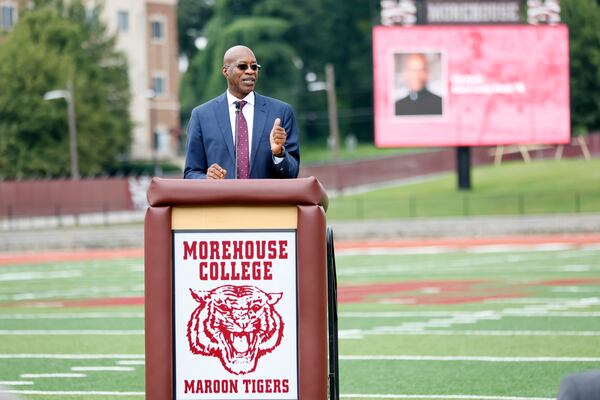 Edwin Moses speaks to guests during the dedication of the newly renovated Edwin C. Moses Track & B.T. Harvey Stadium Football Field at Morehouse College in Atlanta on Tuesday, August 23, 2022. “I must have broken into every track in the city, but I did whatever it took to win,” Moses said.