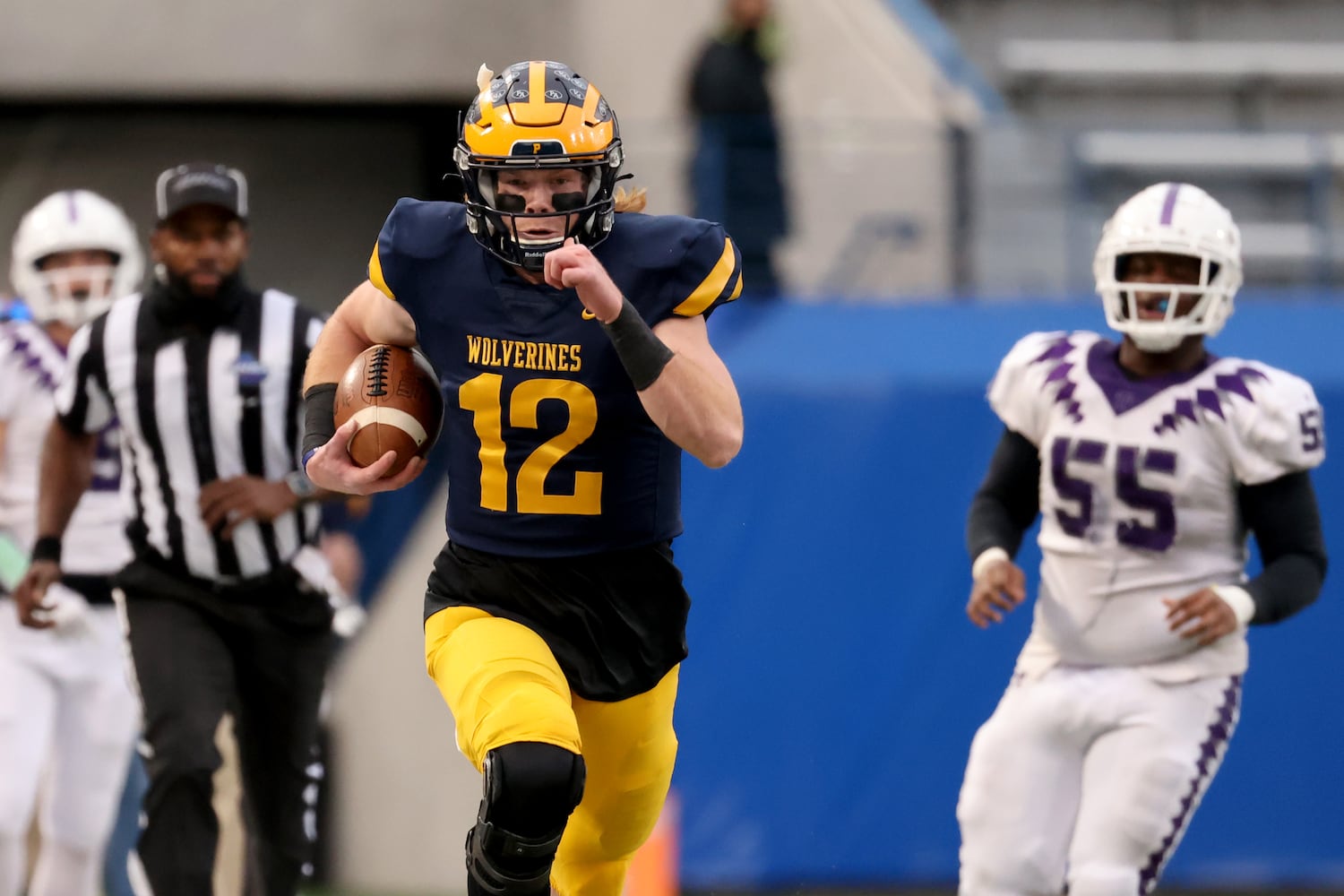 Prince Avenue Christian quarterback Brock Vandagriff (12) runs for a first down in the first half against Trinity Christian during the Class 1A Private championship at Center Parc Stadium Monday, December 28, 2020 in Atlanta, Ga. Vandagriff signed to play at the University of Georgia.  JASON GETZ FOR THE ATLANTA JOURNAL-CONSTITUTION