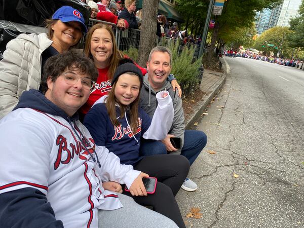 Nate Artzi, Heather Beccaria, Remy Rosenberg, Dana Rosenberg, Mike Rosenberg are near the planned parade end on Peachtree Street just south of 10th Street. (Ariel Hart / Ariel.Hart@ajc.com)