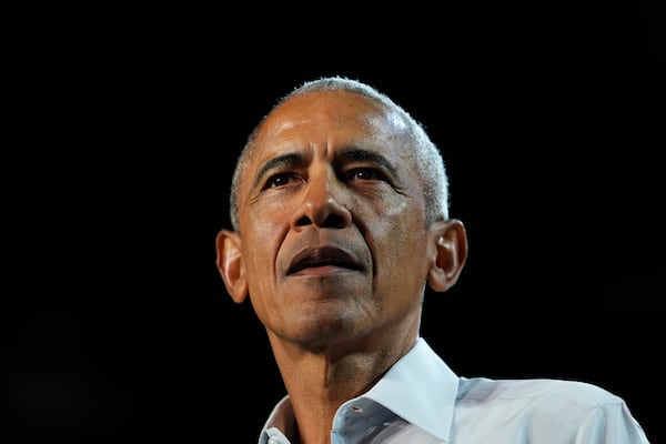 Former President Barack Obama looks on at a campaign rally supporting Democratic presidential nominee Vice President Kamala Harris, Tuesday, Oct. 22, 2024, in Detroit. (AP Photo/Paul Sancya)