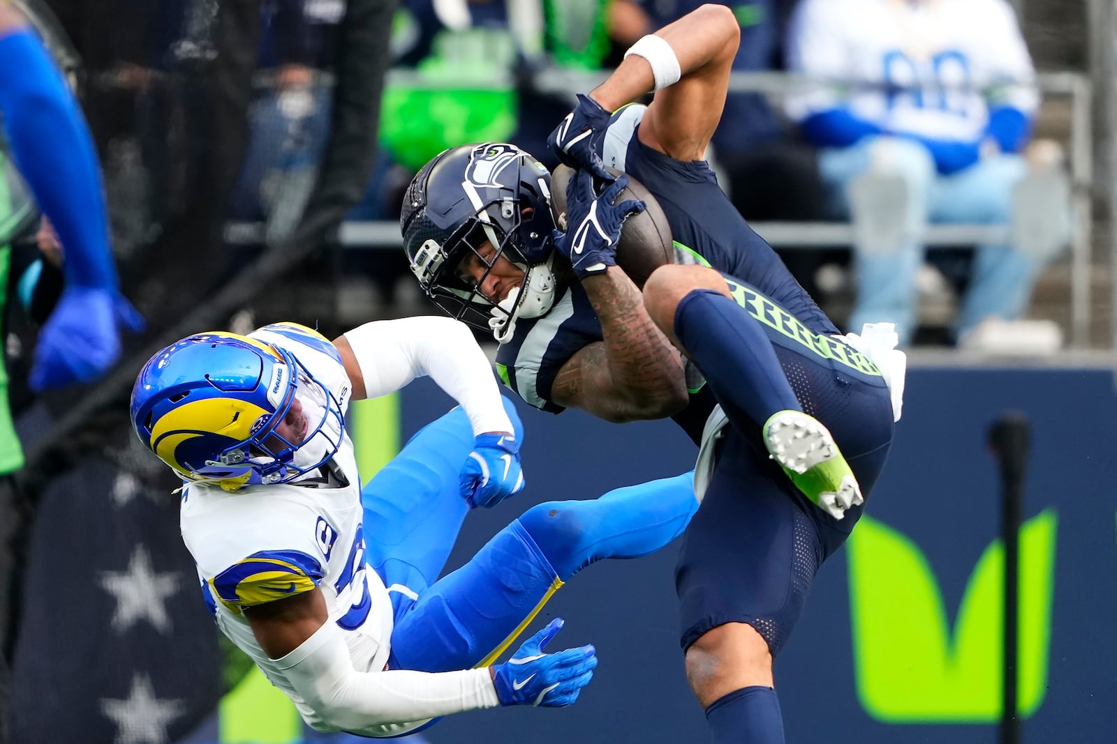 Seattle Seahawks wide receiver Jaxon Smith-Njigba, right, catches a pass against Los Angeles Rams safety Quentin Lake during the first half of an NFL football game in Seattle, Sunday, Nov. 3, 2024. (AP Photo/Lindsey Wasson)