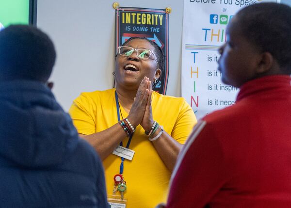 Phoenix Dreamcatcher, a representative from Big Brothers, Big Sisters of Metro Atlanta, plays the game "Never Have I Ever" with Jean Childs Young Middle School students Wednesday, Dec. 7, 2022. Through the game, students share that they've been subject to peer pressure and bullying. (Steve Schaefer/steve.schaefer@ajc.com)