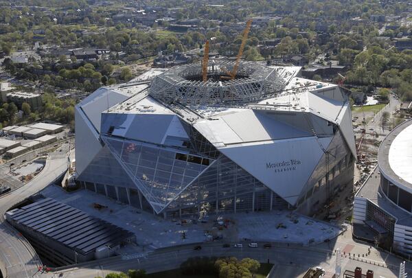 Mercedes Benz Stadium, home of the Atlanta Falcons, sits next to the Georgia Dome. Aerial photos shot March 31, 2017. BOB ANDRES /BANDRES@AJC.COM