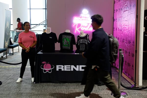 A staff volunteer smiles at a conference attendee as he walks toward the main conference room during the RenderATL Tech conference at AmericasMart in downtown Atlanta on Thursday, June 1, 2023.
Miguel Martinez /miguel.martinezjimenez@ajc.com