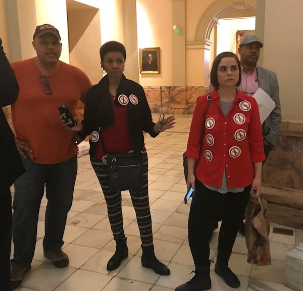 Members of Neighbors Against Greenhaven listen during a pro-cityhood press conference at the State Capitol on Feb. 15, 2018. (TIA MITCHELL/TIA.MITCHELL@AJC.COM)