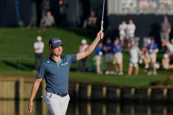 Justin Thomas celebrates after making a birdie on the 17th hole during the second round of The Players Championship golf tournament Friday, March 14, 2025, in Ponte Vedra Beach, Fla. (AP Photo/Chris O'Meara)