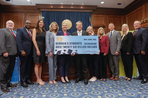 Governor Brian Kemp poses for a photo with members of the Georgia Lottery Corporation and state officials  following a press conference at the Georgia state Capitol celebrating the 30th anniversary of the Georgia Lottery on Wednesday, June 28, 2023. (Natrice Miller/ Natrice.miller@ajc.com)
