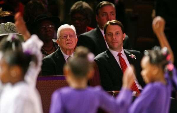 In a 2014 file photo, former President Jimmy Carter and his grandson Jason Carter watch a youth dance performance at Mt. Zion Baptist Church in Albany, Ga. Jason Carter has since been named the chairman of the Carter Center’s board of trustees.  (AP Photo/Phil Sears)