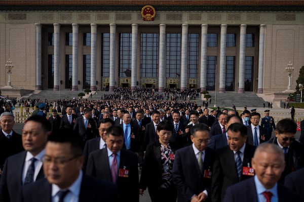 Delegates leave the Great Hall of the People after attending a preparatory session of the National People's Congress in Beijing, Tuesday, March 4, 2025. (AP Photo/Andy Wong)