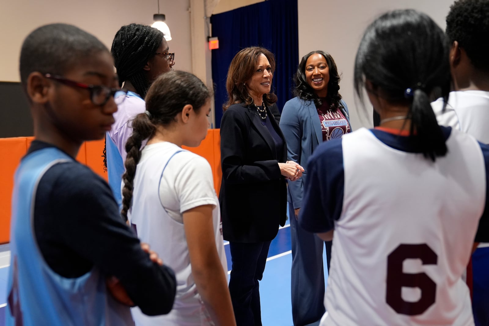 Democratic presidential nominee Vice President Kamala Harris, center, speaks during a community rally at the Alan Horwitz "Sixth Man" Center, Sunday, Oct. 27, 2024, in Philadelphia. (AP Photo/Susan Walsh)