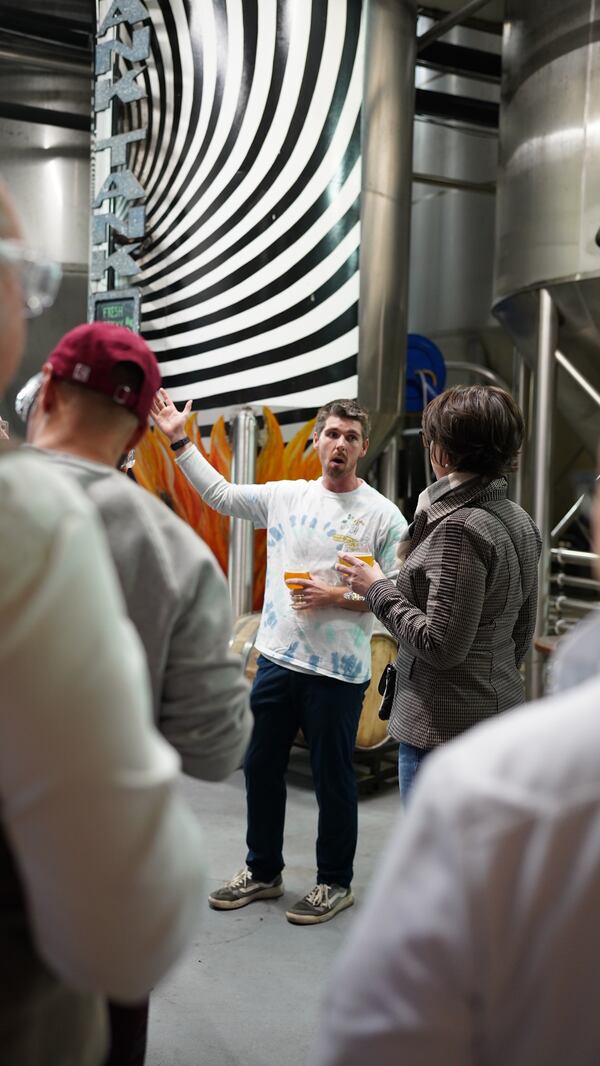 Craft beer connoisseurs get a look at how SweetWater Brewing Company's products are produced.