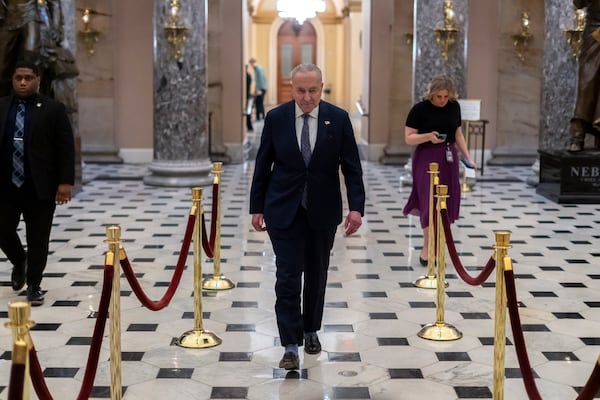 Senate Democratic Leader Chuck Schumer returns after giving a television interview, at the Capitol in Washington, Friday, March 14, 2025. (AP Photo/Ben Curtis)