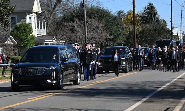 Former first lady Rosalynn Carter’s motorcade moves through downtown Plains Wednesday, November 29, 2023. (Hyosub Shin / Hyosub.Shin@ajc.com)