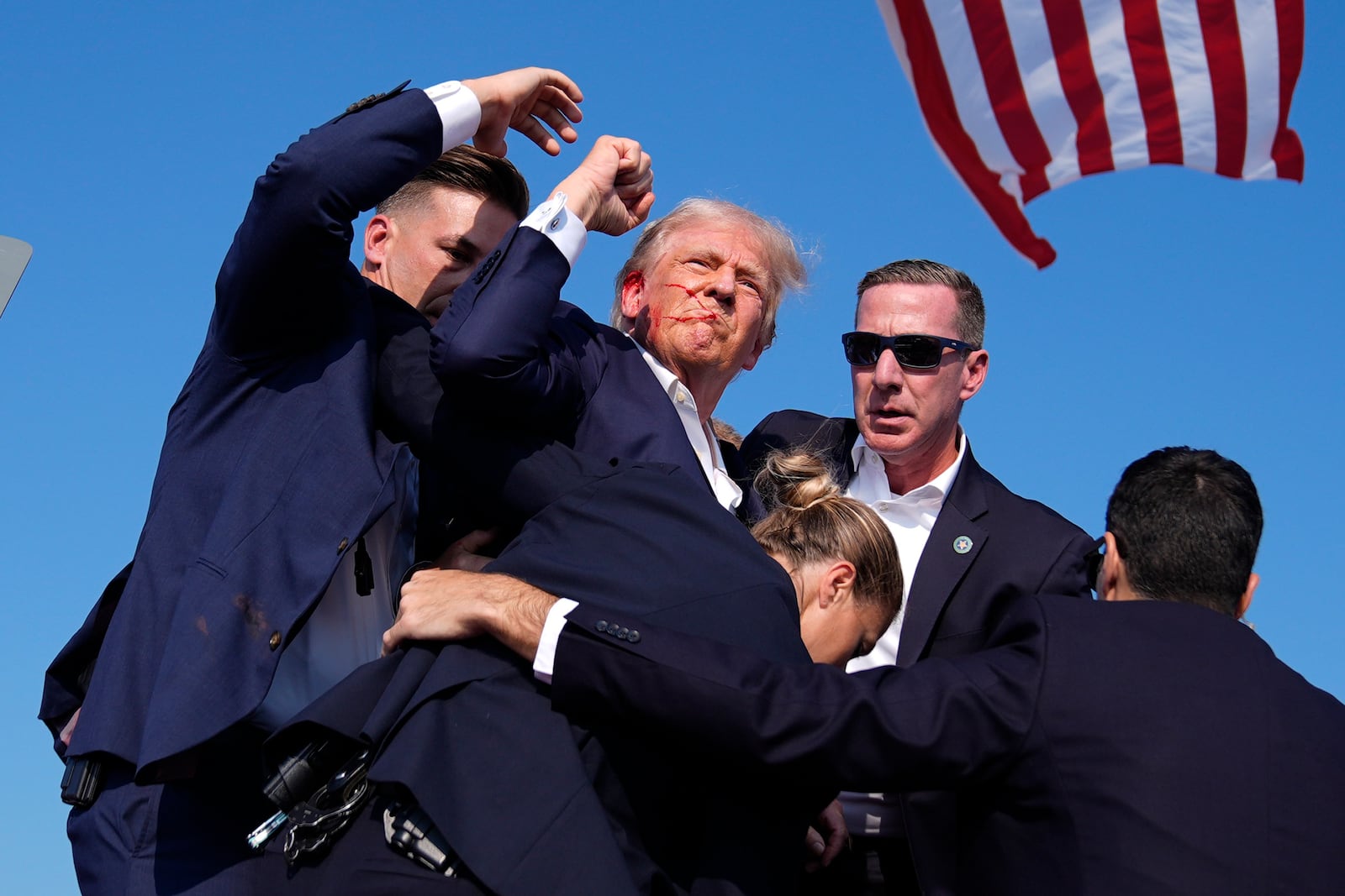 FILE - Republican presidential candidate former President Donald Trump is surrounded by U.S. Secret Service agents at a campaign rally, July 13, 2024, in Butler, Pa. (AP Photo/Evan Vucci, File)