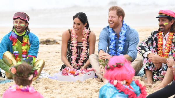 Prince Harry, Duke of Sussex and Meghan, Duchess of Sussex talk to members of OneWave, an awareness group for mental health and wellbeing at South Bondi Beach on October 19, 2018 in Sydney, Australia. The Duke and Duchess of Sussex are on their official 16-day Autumn tour visiting cities in Australia, Fiji, Tonga and New Zealand.