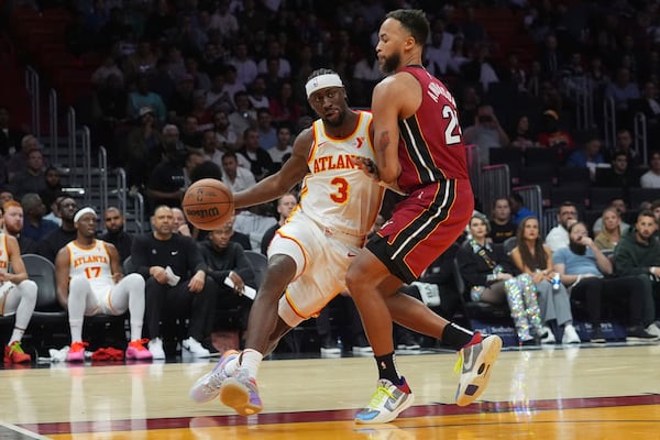 Atlanta Hawks guard Caris LeVert (3) looks to pass the ball as Miami Heat forward Kyle Anderson (20) defends during the first half of an NBA basketball game, Wednesday, Feb. 26, 2025, in Miami. (AP Photo/Marta Lavandier)