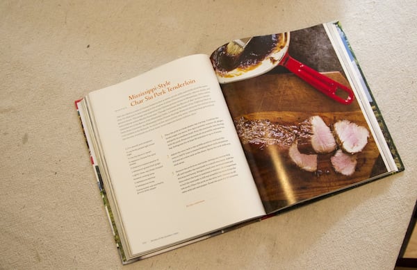 Southern Table: A Food Lover’s Tour of the Global South, Virginia Willis’ new cookbook, is seen in her home in Vinings, Georgia, on Thursday, April 26, 2018. (REANN HUBER/REANN.HUBER@AJC.COM)