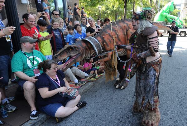 DRAGON CON PARADE--ATLANTA, GA: August 30, 2014 - A lady reacts to a dinosaur during the annual Dragon Con parade in downtown Atlanta. The parade featured 3200 Dragon Con fans dressed as their favorite characters from movies, television, comic books , literature and video games. An estimated 80,000 people watched the parade. Atlanta Journal - Constitution Special/ Johnny Crawford