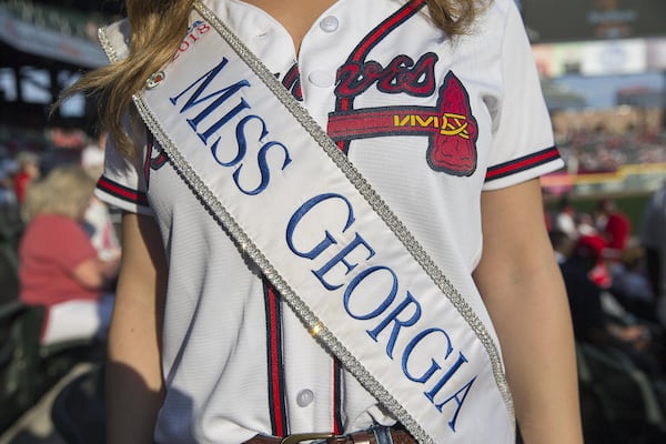 Miss Georgia 2018 Annie Jorgensen wears her sash before the start of a recent Braves game. ALYSSA POINTER / ALYSSA.POINTER@AJC.COM