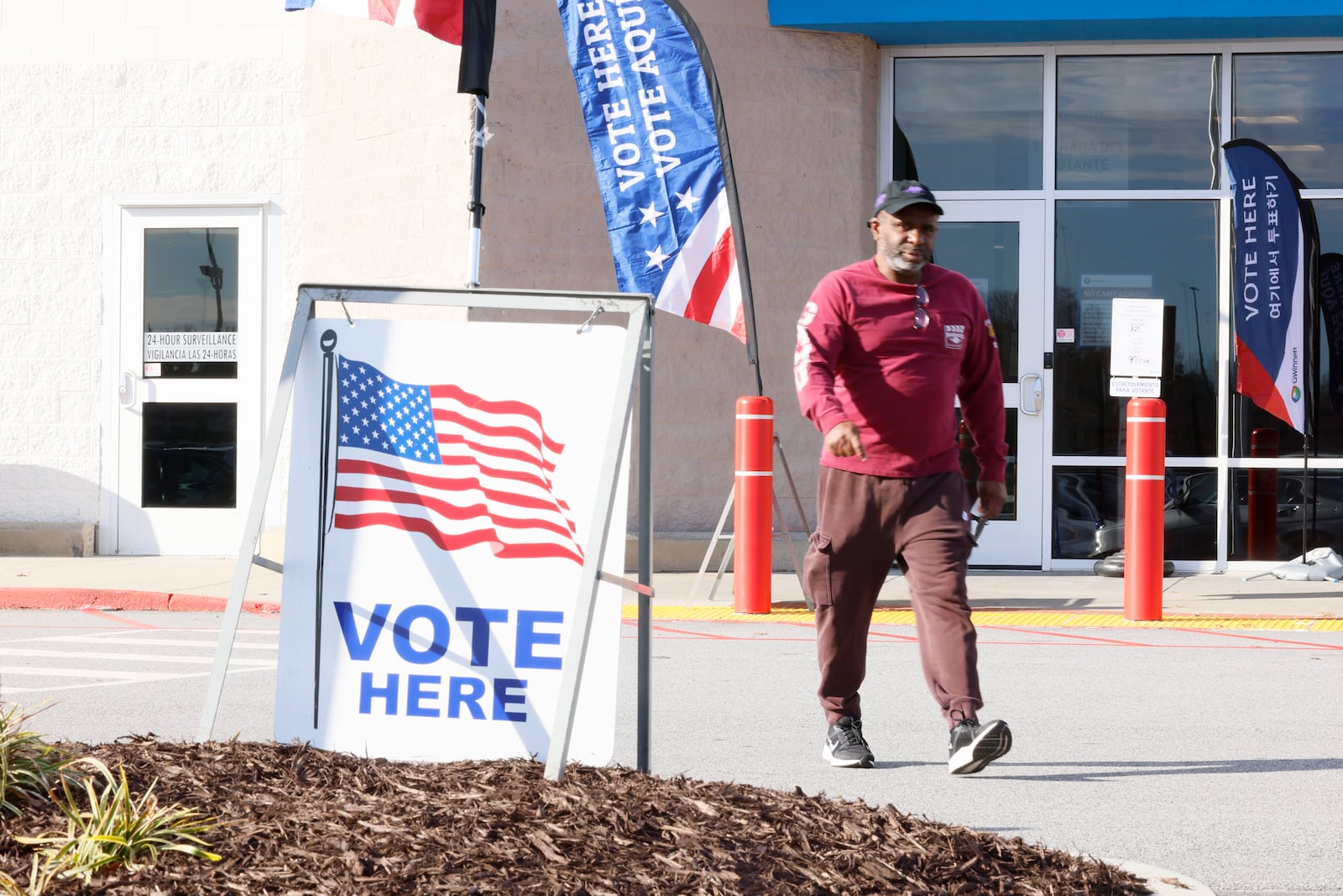 A person is seen leaving the Gwinnett County Voter and Registration Elections on Feb. 19, 2024, the first day of early voting for the Georgia presidential primary. (Miguel Martinez / miguel.martinezjimenez@ajc.com)