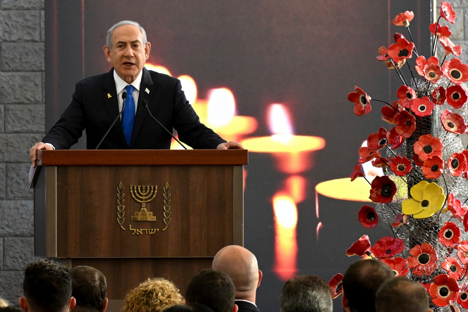 Israeli Prime Minister Benjamin Netanyahu speaks at a memorial ceremony for those killed by Hamas on Oct. 7, 2023, and those who fell in the "Iron Sword" war, at the Knesset, the Parliament, in Jerusalem, Monday, Oct. 28, 2024. (Debbie Hill, Pool Photo via AP)