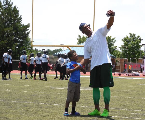 Carolina Panthers QB and Westlake High School alum Cam Newton poses for a selfie with a young superhero! Photo: Jennifer Brett