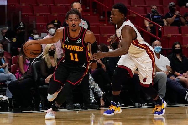 Miami Heat guard Kyle Lowry (7) defends against Hawks guard Trae Young (11) during the first half of a preseason NBA game, Monday, Oct. 4, 2021, in Miami. (Marta Lavandier/AP)