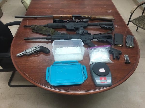 More than 4 pounds of methamphetamine and numerous firearms were recovered.