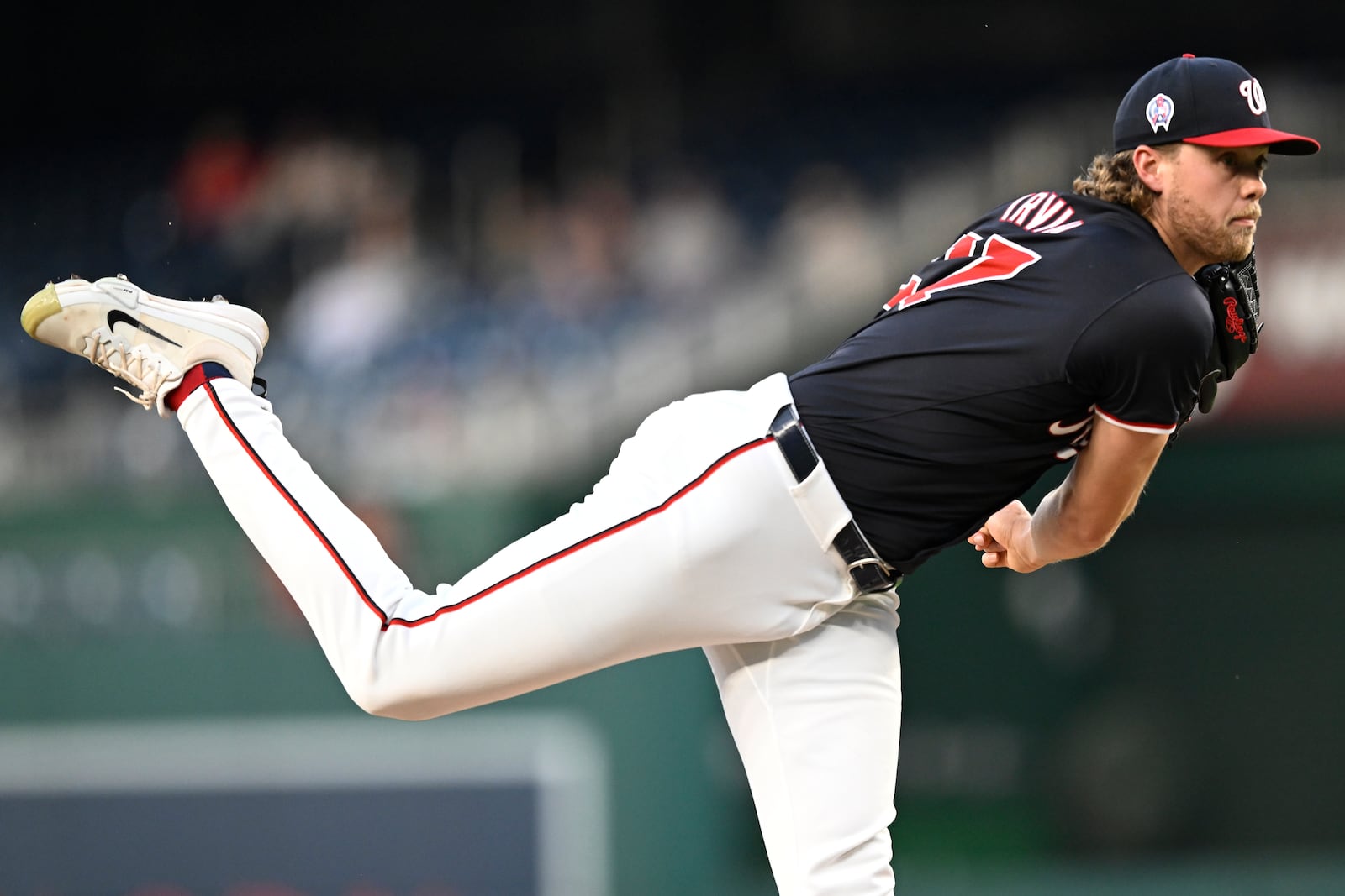 Washington Nationals starting pitcher Jake Irvin follows through during the second inning of a baseball game against the Atlanta Braves, Wednesday, Sept. 11, 2024, in Washington. (AP Photo/John McDonnell)