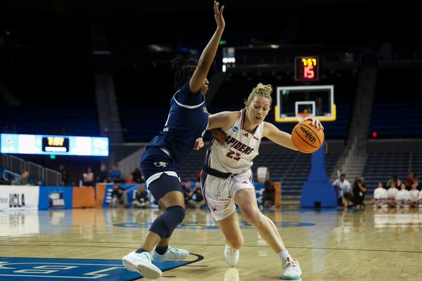 Richmond guard Katie Hill drives against Georgia Tech guard Tonie Morgan during the first half in the first round of the NCAA college basketball tournament, Friday, March 21, 2025, in Los Angeles. (AP Photo/Jessie Alcheh)