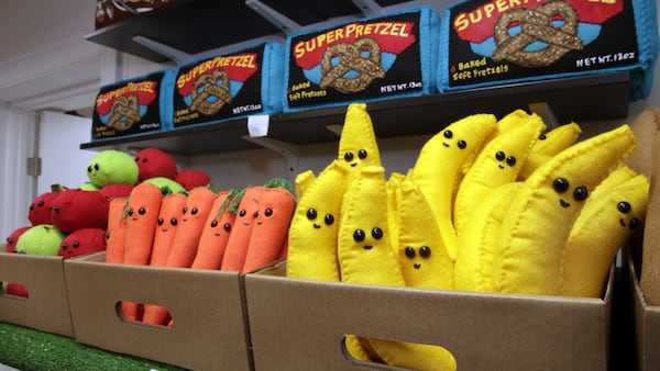 Fruits and vegetables in British artist Lucy Sparrow's all-felt model of a New York City bodega, in New York, are shown in this photo, Monday, June 5, 2017. Her 1,200-square-foot model of a bodega, which opens to the public in Manhattan on Monday, includes plush versions of deli staples like candy bars, cigarettes, canned beans and other items. (AP Photo/Richard Drew)