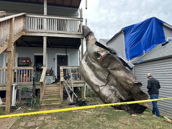 A massive piece of debris that flew from the Givaudan Color Sense plant after an explosion is pictured on Wednesday, Nov. 13, 2024 in Louisville, Ky. (AP Photo/Dylan Lovan)