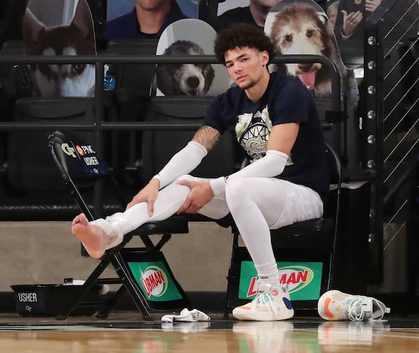 021421 Atlanta: Georgia Tech guard Jordan Usher watches the end of the game against Pittsburgh with his right ankel iced down after leaving the game with an injury in an NCAA college basketball game on Sunday, Feb 14, 2021, in Atlanta.      Curtis Compton / Curtis.Compton@ajc.com”